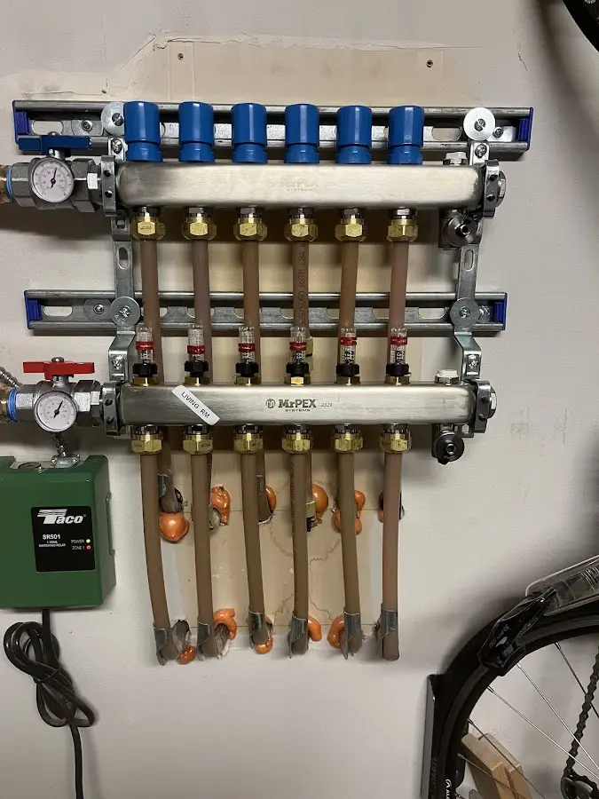 Plumber performing Water Heater Repair at a residential property in Elkton